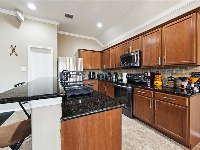 362 Maple Way, New Braunfels, TX 78132 - kitchen featuring appliances with stainless steel finishes, ornamental molding, decorative backsplash, dark stone counters, and an island with sink
