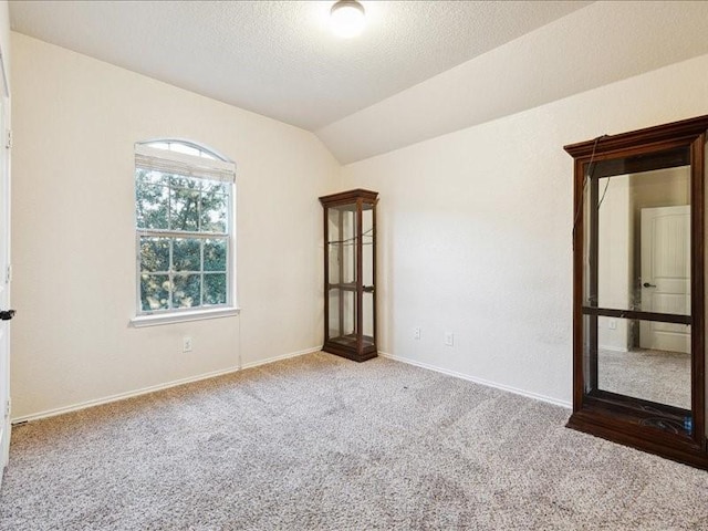 362 Maple Way, New Braunfels, TX 78132 - unfurnished room with carpet, vaulted ceiling, and baseboards