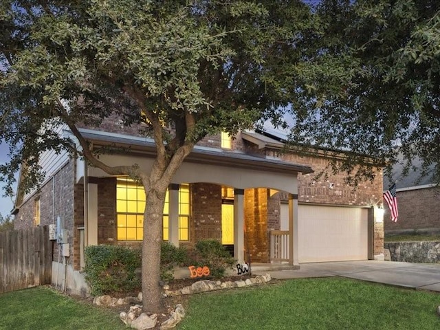 362 Maple Way, New Braunfels, TX 78132 - view of front of home featuring driveway, brick siding, and a garage