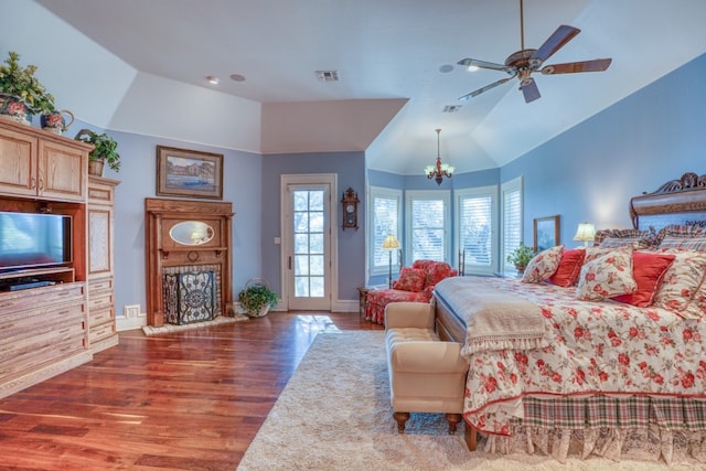 530 Scenic View Dr, Marble Falls, TX 78654 - bedroom with vaulted ceiling, wood finished floors, access to outside, a chandelier, and baseboards