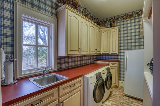 530 Scenic View Dr, Marble Falls, TX 78654 - washroom with washing machine and clothes dryer, cabinet space, brick floors, wallpapered walls, and plenty of natural light