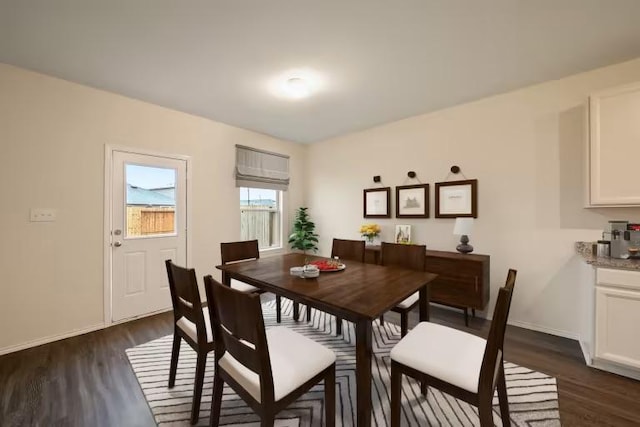 576 Tailwind Dr, Kyle, TX 78640 - dining area featuring dark wood finished floors and baseboards