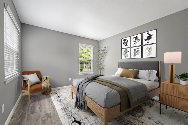 8330 Fathom Cir Unit 404, Austin, TX 78750 - bedroom with wood finished floors and baseboards