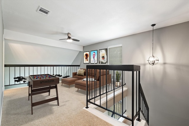 8330 Fathom Cir Unit 404, Austin, TX 78750 - playroom featuring a ceiling fan, carpet flooring, and vaulted ceiling