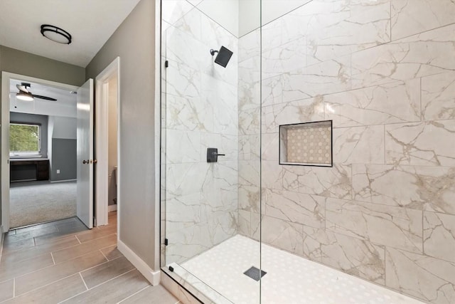 8330 Fathom Cir Unit 404, Austin, TX 78750 - bathroom featuring tiled shower and baseboards