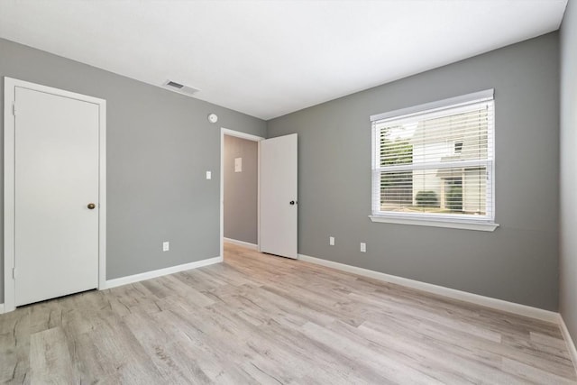 8330 Fathom Cir Unit 404, Austin, TX 78750 - unfurnished bedroom with light wood-style flooring and baseboards
