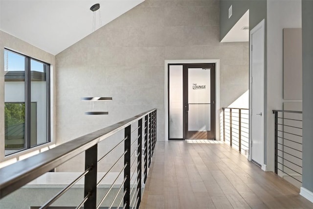 2551 Waymaker Way, Austin, TX 78746 - corridor featuring lofted ceiling and wood finished floors
