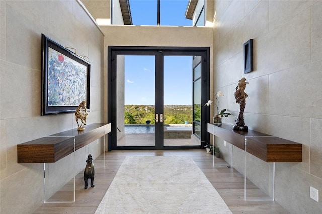 2551 Waymaker Way, Austin, TX 78746 - entryway with french doors and wood finished floors