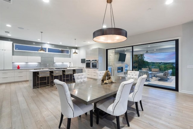2551 Waymaker Way, Austin, TX 78746 - dining space with light wood-style floors and recessed lighting