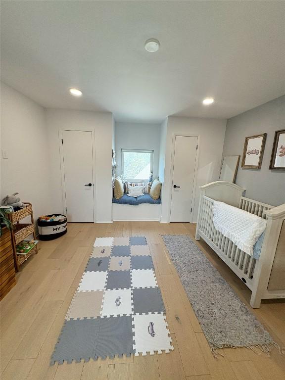 10705 Oak Valley Ct, Austin, TX 78736 - bedroom featuring wood-type flooring and recessed lighting