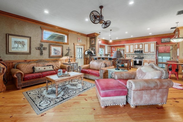 1110 County Road 487, Taylor, TX 76574 - living area featuring ornamental molding, light wood finished floors, and recessed lighting