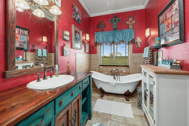 1110 County Road 487, Taylor, TX 76574 - bathroom with tile walls, vanity, a soaking tub, ornamental molding, and a wainscoted wall