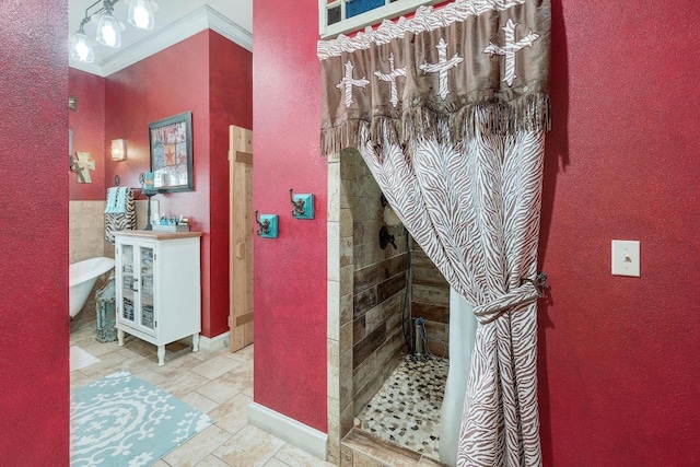 1110 County Road 487, Taylor, TX 76574 - bathroom featuring a shower stall, a freestanding bath, ornamental molding, vanity, and a textured wall
