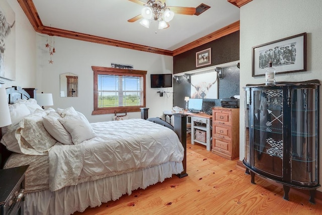 1110 County Road 487, Taylor, TX 76574 - bedroom featuring crown molding, light wood-style flooring, and ceiling fan