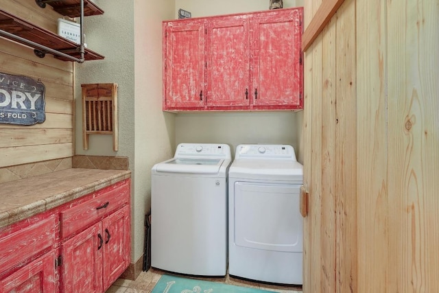 1110 County Road 487, Taylor, TX 76574 - laundry room featuring cabinet space and washer and clothes dryer