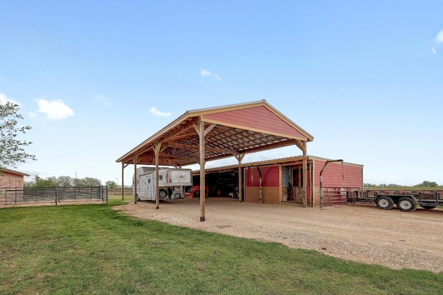 1110 County Road 487, Taylor, TX 76574 - view of car parking featuring a carport, dirt driveway, and an exterior structure