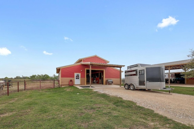 1110 County Road 487, Taylor, TX 76574 - back of property featuring an outbuilding and a garage