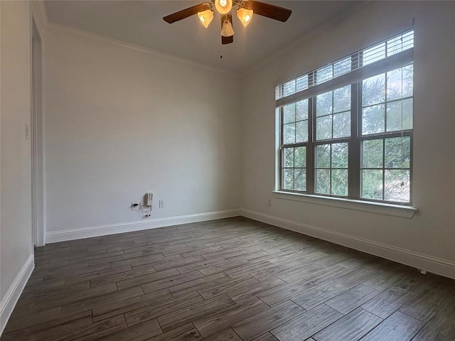 1902 Aves Cv, Pflugerville, TX 78660 - spare room featuring dark wood-style floors, ceiling fan, crown molding, and baseboards