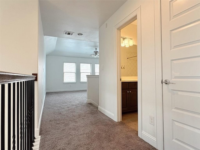 1902 Aves Cv, Pflugerville, TX 78660 - hallway featuring carpet, baseboards, and an upstairs landing