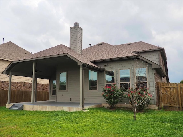 1902 Aves Cv, Pflugerville, TX 78660 - back of property featuring a patio area, roof with shingles, a chimney, and a ceiling fan