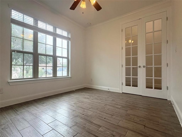 1902 Aves Cv, Pflugerville, TX 78660 - empty room with ornamental molding, ceiling fan, french doors, dark wood-style flooring, and baseboards