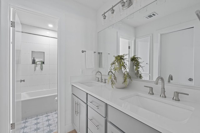 10300 Mourning Dove Dr, Austin, TX 78750 - bathroom featuring tile patterned floors, double vanity, toilet, and shower / washtub combination