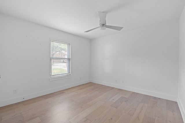 10300 Mourning Dove Dr, Austin, TX 78750 - spare room with baseboards, light wood-style floors, and a ceiling fan