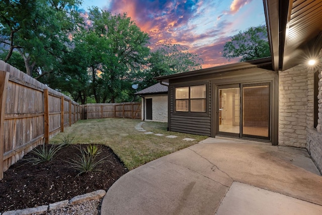 10300 Mourning Dove Dr, Austin, TX 78750 - yard at dusk with a patio area