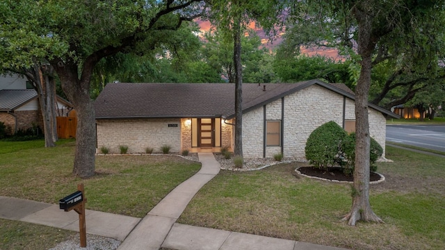 10300 Mourning Dove Dr, Austin, TX 78750 - mid-century home with stone siding and roof with shingles