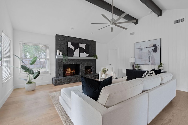 10300 Mourning Dove Dr, Austin, TX 78750 - living room featuring wood finished floors, a fireplace, a ceiling fan, and baseboards