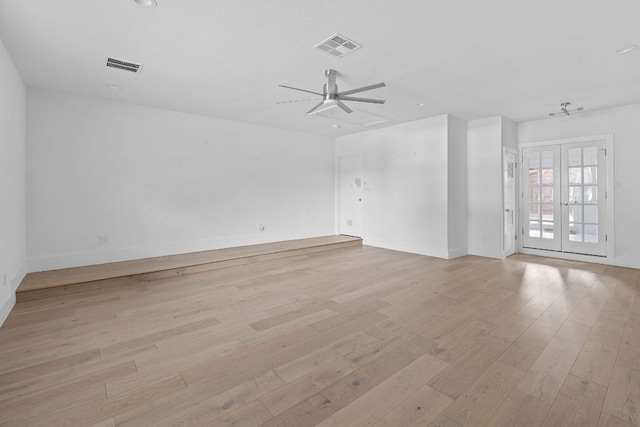 10300 Mourning Dove Dr, Austin, TX 78750 - empty room featuring light wood-style floors, ceiling fan, baseboards, and french doors