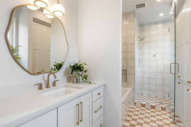 4600 Parkdale Pl, Austin, TX 78745 - full bathroom featuring a tile shower, vanity, and recessed lighting