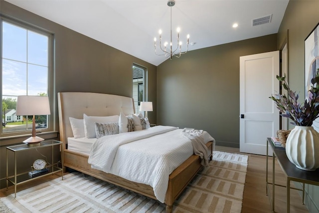 4600 Parkdale Pl, Austin, TX 78745 - bedroom featuring a chandelier, wood finished floors, vaulted ceiling, and recessed lighting