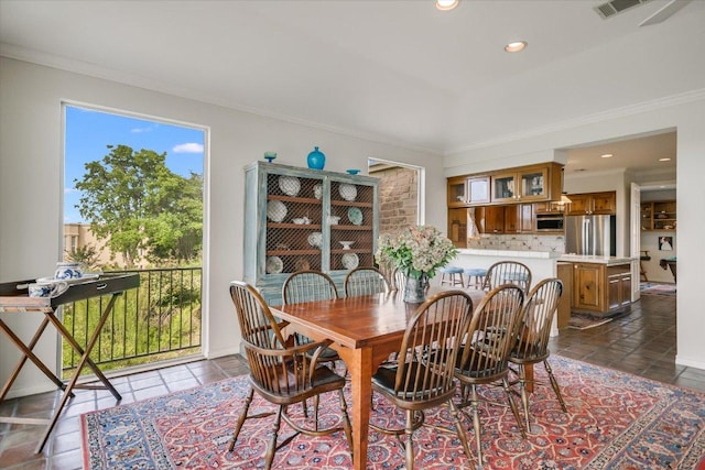 137 Firebird St, Lakeway, TX 78734 - dining room with crown molding, recessed lighting, and dark tile patterned flooring