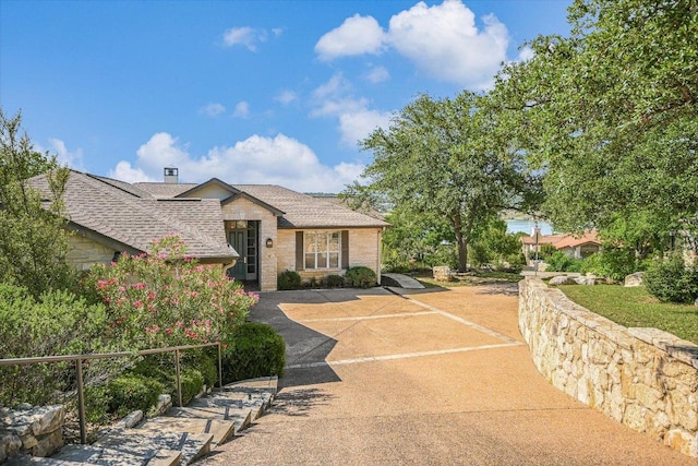 137 Firebird St, Lakeway, TX 78734 - view of front facade featuring stone siding and a shingled roof