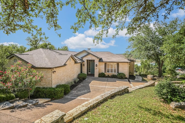 137 Firebird St, Lakeway, TX 78734 - ranch-style home with stone siding and roof with shingles