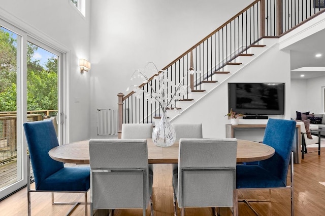 4107 Jefferson St, Austin, TX 78731 - dining space with a towering ceiling, plenty of natural light, wood finished floors, and stairway
