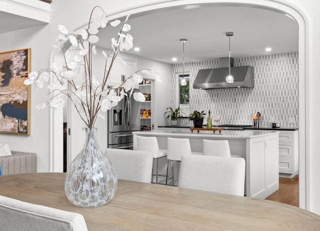 4107 Jefferson St, Austin, TX 78731 - dining space featuring arched walkways, recessed lighting, and wood finished floors