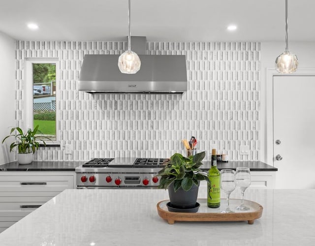 4107 Jefferson St, Austin, TX 78731 - kitchen with extractor fan, stainless steel gas range oven, backsplash, white cabinets, and recessed lighting