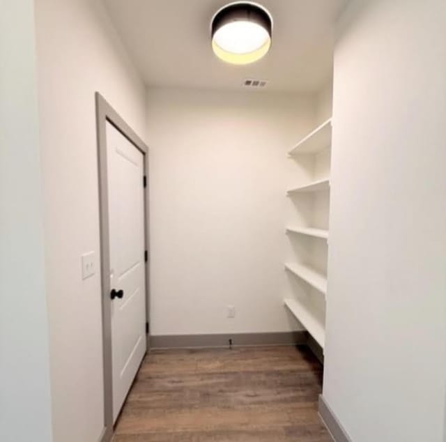 2450 Wickersham Ln Unit 1926, Austin, TX 78741 - spacious closet with wood finished floors