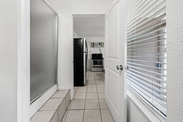 1010 W 23rd St Unit 16, Austin, TX 78705 - hall featuring light tile patterned flooring and a wall mounted AC