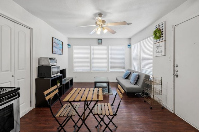 1010 W 23rd St Unit 16, Austin, TX 78705 - living room featuring ceiling fan, wood finished floors, and baseboards