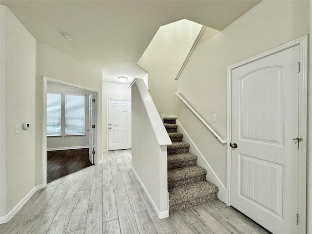 513 N Heatherwilde Blvd, Pflugerville, TX 78660 - staircase featuring wood finished floors and baseboards