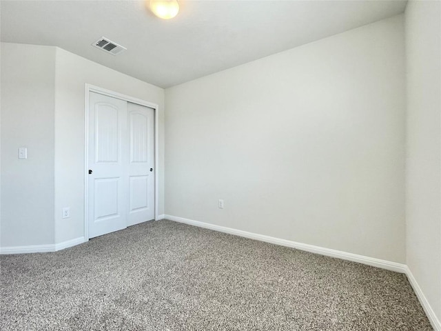 513 N Heatherwilde Blvd, Pflugerville, TX 78660 - unfurnished bedroom featuring carpet, baseboards, and a closet