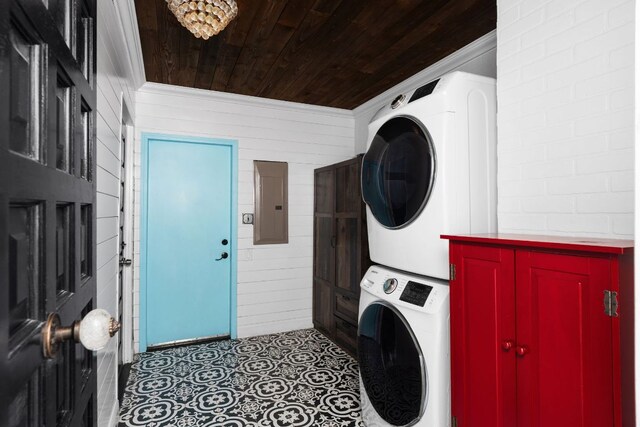 2403 Little John Ln, Austin, TX 78704 - laundry room featuring stacked washer / drying machine, wood ceiling, wood walls, crown molding, and electric panel