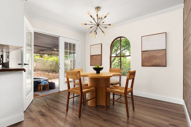 2403 Little John Ln, Austin, TX 78704 - dining room with a chandelier, dark wood-type flooring, crown molding, baseboards, and french doors
