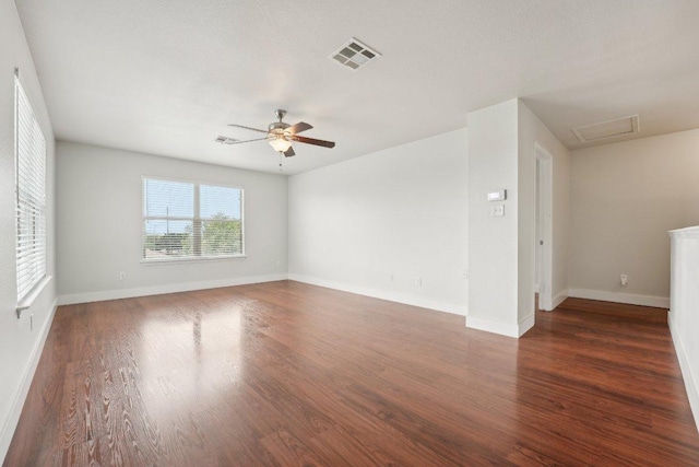100 Blanco Woods Blvd, Elgin, TX 78621 - empty room with a ceiling fan, wood finished floors, attic access, and baseboards