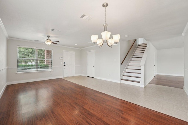 100 Blanco Woods Blvd, Elgin, TX 78621 - unfurnished living room with crown molding, stairway, a chandelier, tile patterned flooring, and baseboards
