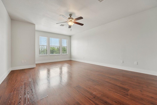 100 Blanco Woods Blvd, Elgin, TX 78621 - unfurnished room featuring a ceiling fan, wood finished floors, and baseboards