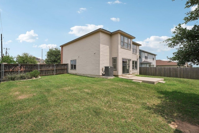 100 Blanco Woods Blvd, Elgin, TX 78621 - back of property with central AC and a patio area